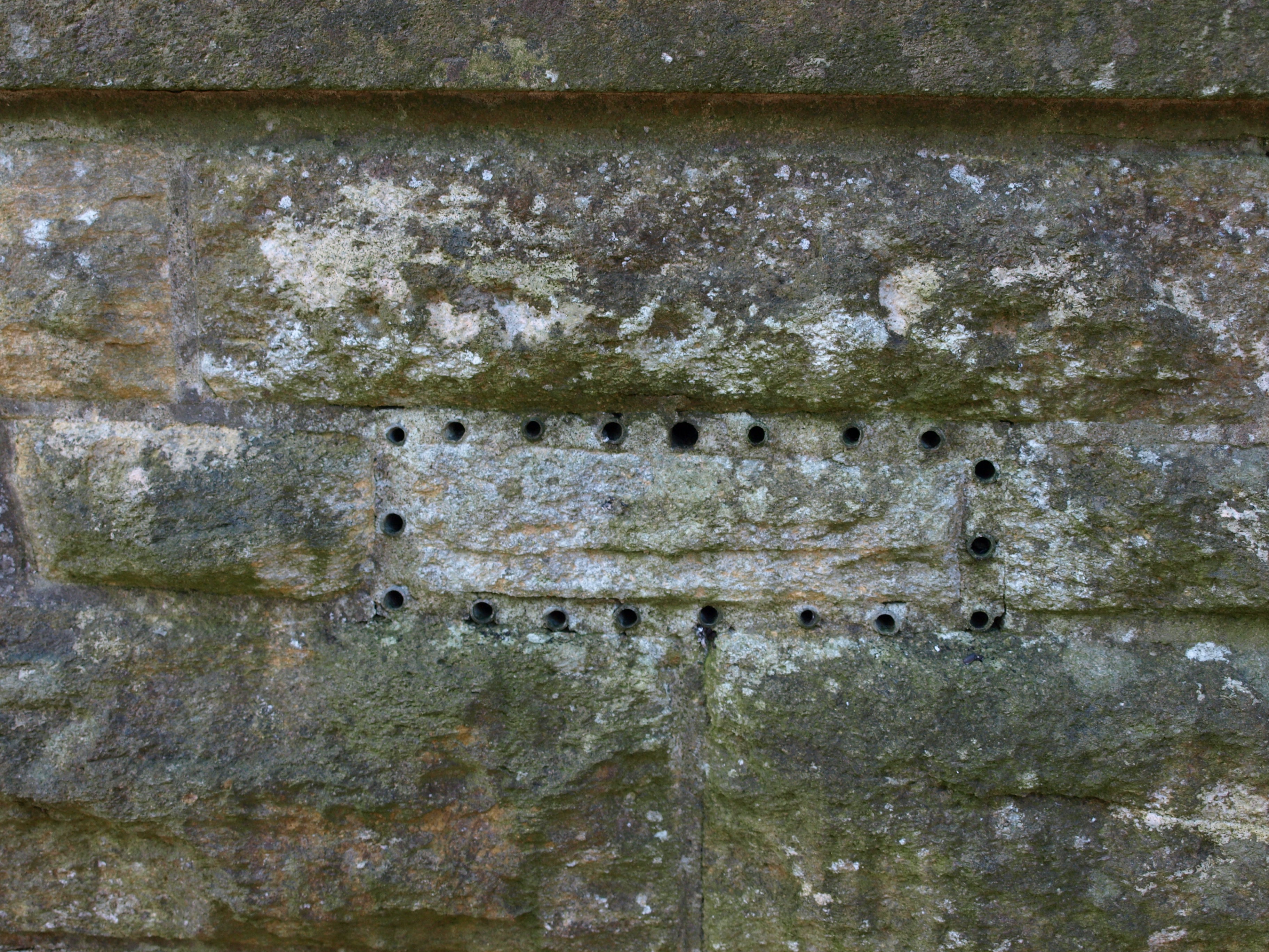 Vent holes in the side of the mausoleum