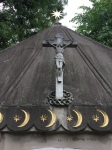 Crucifix crown of thorns and gold Star of Bethlehem on roof of mausoleum