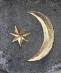 star and crescent design in gold on mausoleum roof