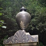 stone urn on top of cemetery graveyard tomb memorial